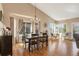 Bright dining area featuring hardwood floors, bay windows, and ample natural light, perfect for Gathering meals at 2533 W 110Th Ave, Westminster, CO 80234