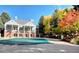 Exterior of the home overlooking the outdoor pool with beautiful fall foliage in view at 2533 W 110Th Ave, Westminster, CO 80234