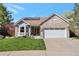 Charming single-Gathering home showcasing a well-manicured lawn, complemented by a brick and gray color scheme at 2533 W 110Th Ave, Westminster, CO 80234