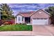 Charming brick home with a two-car garage, bay window, and solar panels set in a well-manicured yard at 2533 W 110Th Ave, Westminster, CO 80234