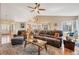 Spacious living room with a vaulted ceiling, hardwood floors, and comfortable leather seating creating a relaxing atmosphere at 2533 W 110Th Ave, Westminster, CO 80234