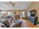 Inviting living room with a fireplace, hardwood floors, and comfortable leather seating creating a cozy atmosphere at 2533 W 110Th Ave, Westminster, CO 80234