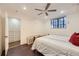 Bright bedroom featuring recessed lighting, a window, hardwood floors, and closet space at 2233 Kearney St # 19, Denver, CO 80207