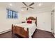 Cozy bedroom with ceiling fan, recessed lighting, a large window, and hardwood flooring at 2233 Kearney St # 19, Denver, CO 80207