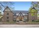 Beautiful brick building featuring unique tudor architectural style and manicured landscaping at 2233 Kearney St # 19, Denver, CO 80207