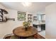 Bright, open kitchen with views to dining table, stylish tile flooring, countertops, and dark green lower cabinets at 2233 Kearney St # 19, Denver, CO 80207