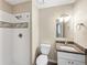Well-lit bathroom with white tiled shower, granite vanity, and modern fixtures; comfortable space at 18945 E 45Th Ave, Denver, CO 80249