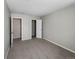 Bedroom featuring carpeted floors, closet, and doorway, providing a calming space at 18945 E 45Th Ave, Denver, CO 80249
