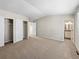 Spacious bedroom with neutral carpet, dual closets, and ensuite bath access; lots of natural light at 18945 E 45Th Ave, Denver, CO 80249