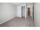 Comfortable bedroom with carpeted floors, a closet, and access to hallway at 18945 E 45Th Ave, Denver, CO 80249