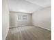 A tranquil room with neutral carpet, a window with blinds, and an electrical outlet on the wall at 18945 E 45Th Ave, Denver, CO 80249