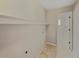 Functional laundry room with tile floors, shelving and a doorway to another room at 18945 E 45Th Ave, Denver, CO 80249