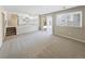 Open living space with staircase, sliding door and railing overlooking the kitchen at 18945 E 45Th Ave, Denver, CO 80249