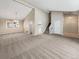 Spacious living room with vaulted ceilings, neutral carpet and natural light from large window at 18945 E 45Th Ave, Denver, CO 80249
