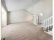Spacious open-concept living room with neutral walls, vaulted ceilings, and seamless flow to other rooms at 18945 E 45Th Ave, Denver, CO 80249