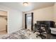 Bedroom featuring a desk, chair, and closet at 18809 E 66Th Ave, Denver, CO 80249