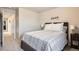 Comfortable bedroom with a bed and neutral walls at 18809 E 66Th Ave, Denver, CO 80249