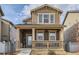 Charming two-story home with a welcoming front porch and tasteful exterior details at 18809 E 66Th Ave, Denver, CO 80249