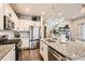 Well-appointed kitchen featuring stainless steel appliances, a center island, and ample counter space at 18809 E 66Th Ave, Denver, CO 80249
