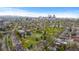 Aerial view highlighting the neighborhood, showcasing lush greenery and a park at 1090 E 3Rd Ave, Denver, CO 80218