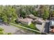 An aerial view captures the house with a brown roof, a garage, and surrounding landscaping at 1090 E 3Rd Ave, Denver, CO 80218