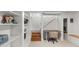 Basement area featuring built-in shelves, desk, and cozy reading nook near the stairs at 1090 E 3Rd Ave, Denver, CO 80218