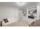 Cozy finished basement with built-in shelves and comfortable seating, ideal for relaxation and leisure activities at 1090 E 3Rd Ave, Denver, CO 80218