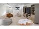 Spacious basement with custom entertainment center and multiple seating options at 1090 E 3Rd Ave, Denver, CO 80218