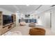 Bright basement area featuring a wet bar with a sink and refrigerator, perfect for entertaining and relaxation at 1090 E 3Rd Ave, Denver, CO 80218
