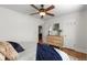 Spacious bedroom with a ceiling fan and natural light from the window at 1090 E 3Rd Ave, Denver, CO 80218