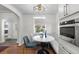 Charming breakfast nook with a marble table, window views, and stainless steel appliances for cozy dining at 1090 E 3Rd Ave, Denver, CO 80218