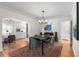 Elegant dining room with modern chandelier, stylish rug, and seamless flow to breakfast nook at 1090 E 3Rd Ave, Denver, CO 80218