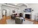Spacious living room with fireplace, hardwood floors, and an abundance of natural light at 1090 E 3Rd Ave, Denver, CO 80218