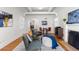 Bright living room featuring a fireplace, hardwood floors, and an abundance of natural light at 1090 E 3Rd Ave, Denver, CO 80218