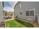 Spacious backyard featuring a patio, grill, and lush lawn, perfect for outdoor entertaining and recreation at 14332 Craftsman Way, Broomfield, CO 80023