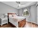 Cozy bedroom featuring hardwood floors, a ceiling fan, and a comfortable bed with soft pastel colored accents at 14332 Craftsman Way, Broomfield, CO 80023