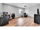 Versatile bonus room with hardwood floors, natural light, and space for a home office and seating area at 14332 Craftsman Way, Broomfield, CO 80023