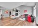 Bright living room featuring hardwood floors, a modern fireplace, and comfortable seating arrangement at 14332 Craftsman Way, Broomfield, CO 80023