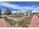 Community playground with swings and play structures nestled among trees, providing a fun space for children at 14332 Craftsman Way, Broomfield, CO 80023