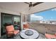 Balcony with mountain views features wrought iron seating around a fire pit at 2 Adams St # 705, Denver, CO 80206