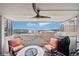 Balcony features cityscape views and comfortable seating with a grill at 2 Adams St # 705, Denver, CO 80206