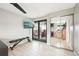 A bright bedroom with a ceiling fan, balcony, and closet access at 2 Adams St # 705, Denver, CO 80206