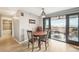 Inviting dining room showcasing balcony access, new floors, and adjacent to the kitchen at 2 Adams St # 705, Denver, CO 80206