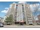 Exterior view of the high-rise condo building under a clear sky at 2 Adams St # 705, Denver, CO 80206