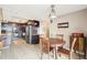 Contemporary kitchen and dining area features modern appliances and lots of storage at 2 Adams St # 705, Denver, CO 80206
