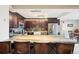 Modern kitchen featuring stainless steel appliances, bar seating, and open layout to living and dining at 2 Adams St # 705, Denver, CO 80206