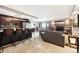 Open concept floorplan featuring living room fireplace, kitchen island and sliding doors to balcony at 2 Adams St # 705, Denver, CO 80206
