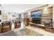 Bright living room offering a fireplace, access to the balcony, and is adjacent to the dining area at 2 Adams St # 705, Denver, CO 80206