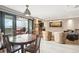 Open floorplan showing dining area, living room, and balcony access at 2 Adams St # 705, Denver, CO 80206