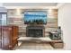 Comfortable living room features a fireplace, updated flooring, and neutral paint colors at 2 Adams St # 705, Denver, CO 80206